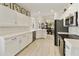 Modern white kitchen with stainless steel appliances at 23817 S Harmony Way, Sun Lakes, AZ 85248