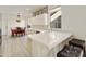 Modern kitchen with white cabinets, quartz countertops, and stainless steel appliances at 23817 S Harmony Way, Sun Lakes, AZ 85248