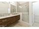 Double vanity bathroom with a walk-in shower at 23817 S Harmony Way, Sun Lakes, AZ 85248