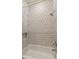 Clean bathroom with a shower/tub combo and patterned tile at 23817 S Harmony Way, Sun Lakes, AZ 85248