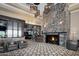 Restaurant lobby with stone fireplace and comfortable seating at 23817 S Harmony Way, Sun Lakes, AZ 85248