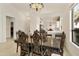 Elegant dining room featuring a large wood table and ornate chairs at 23817 S Harmony Way, Sun Lakes, AZ 85248