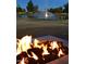 Relaxing fire pit area with beautiful water fountain views at 23817 S Harmony Way, Sun Lakes, AZ 85248