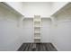 Walk-in closet with ample shelving and hanging space at 12568 W Orangewood Ave, Glendale, AZ 85307