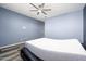 Spacious bedroom with ceiling fan and wood-look flooring at 12568 W Orangewood Ave, Glendale, AZ 85307