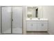 Bathroom with double vanity and shower at 12568 W Orangewood Ave, Glendale, AZ 85307