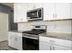 Modern kitchen with stainless steel appliances at 12568 W Orangewood Ave, Glendale, AZ 85307