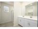Modern bathroom with double vanity and walk-in shower at 12568 W Orangewood Ave, Glendale, AZ 85307