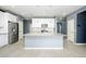 Modern kitchen with island and stainless steel appliances at 12568 W Orangewood Ave, Glendale, AZ 85307