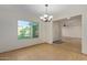 Bright dining room with tile floors and a chandelier at 10650 N 49Th Ave, Glendale, AZ 85304