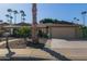 Ranch-style home with a two-car garage and desert landscaping at 10650 N 49Th Ave, Glendale, AZ 85304