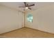 Bedroom with tile flooring and backyard view at 10650 N 49Th Ave, Glendale, AZ 85304