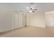 Bedroom with tile flooring and mirrored closet doors at 10650 N 49Th Ave, Glendale, AZ 85304