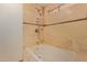 Bathroom with beige tile and tub shower combo at 10650 N 49Th Ave, Glendale, AZ 85304