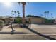 Ranch-style house with a two-car garage and palm trees at 10650 N 49Th Ave, Glendale, AZ 85304