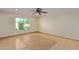Bright bedroom with tile flooring and a large window at 10650 N 49Th Ave, Glendale, AZ 85304