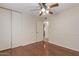 Bedroom with wood flooring and closet at 10650 N 49Th Ave, Glendale, AZ 85304