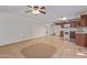 Kitchen with brown cabinets, white appliances, and tile floor at 10650 N 49Th Ave, Glendale, AZ 85304