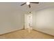Bedroom with tile flooring and access to hallway at 10650 N 49Th Ave, Glendale, AZ 85304