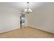 Dining room with tile floor and view into kitchen at 10650 N 49Th Ave, Glendale, AZ 85304