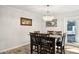 Bright dining room with a chandelier and seating for six at 3007 E Calaveros Dr, Phoenix, AZ 85028