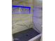 Modern shower with marble tile and LED lighting at 20216 W Desert Bloom St, Buckeye, AZ 85326