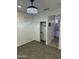 Bright bedroom with carpet flooring, a large closet, and access to a bathroom at 20216 W Desert Bloom St, Buckeye, AZ 85326