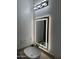 Bathroom with single vanity and LED lit mirror at 20216 W Desert Bloom St, Buckeye, AZ 85326
