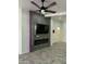 Modern fireplace with LED lighting and a large TV above at 20216 W Desert Bloom St, Buckeye, AZ 85326