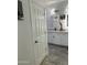 Bathroom with white cabinets, double sinks, and a modern mirror at 20216 W Desert Bloom St, Buckeye, AZ 85326