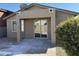 Home exterior with covered patio and landscaping at 20216 W Desert Bloom St, Buckeye, AZ 85326