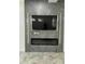 Contemporary fireplace with LED lighting and built-in shelving at 20216 W Desert Bloom St, Buckeye, AZ 85326