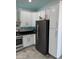 Modern kitchen with white cabinets, stainless steel appliances, and granite countertops at 20216 W Desert Bloom St, Buckeye, AZ 85326