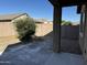 Small backyard with gravel and a small tree at 20216 W Desert Bloom St, Buckeye, AZ 85326