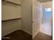 Large walk-in closet with shelving and access to bathroom at 2667 S 156Th Ave, Goodyear, AZ 85338