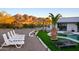 Landscaped backyard with pool, spa, and mountain views at 6529 N Mountain View Dr, Paradise Valley, AZ 85253