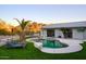 Modern pool and spa with lounge chairs and mountain views at 6529 N Mountain View Dr, Paradise Valley, AZ 85253