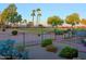 Landscaped backyard with a patio and golf course view at 15736 W Roanoke Ave, Goodyear, AZ 85395