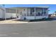 Mobile home exterior with carport and landscaping at 7750 E Broadway Rd # 761, Mesa, AZ 85208