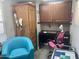 Home office featuring a desk, chair, and wood cabinet for storage at 7750 E Broadway Rd # 761, Mesa, AZ 85208