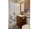 Clean bathroom with wood vanity and shower/tub at 7750 E Broadway Rd # 761, Mesa, AZ 85208