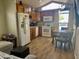 Efficient kitchen featuring wood cabinets, modern appliances, and a dining area at 7750 E Broadway Rd # 761, Mesa, AZ 85208