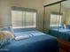 Comfortable bedroom with mirrored closet and window at 7750 E Broadway Rd # 761, Mesa, AZ 85208