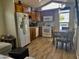 Bright kitchen with wood cabinets and dining area at 7750 E Broadway Rd # 761, Mesa, AZ 85208