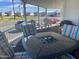 Relaxing covered patio with outdoor furniture and grill, offering a view of the community at 7750 E Broadway Rd # 761, Mesa, AZ 85208