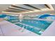 Indoor swimming pool with calming blue wave design at 16866 S 180Th Ave, Goodyear, AZ 85338
