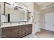 Spa-like bathroom with dual vanities and a walk-in shower at 16866 S 180Th Ave, Goodyear, AZ 85338