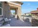 Covered patio with stone flooring and comfortable seating at 16866 S 180Th Ave, Goodyear, AZ 85338