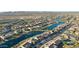 Bird's-eye view of community with lake and surrounding desert landscape at 16866 S 180Th Ave, Goodyear, AZ 85338