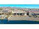 Stunning aerial view of lakefront home with mountain backdrop at 16866 S 180Th Ave, Goodyear, AZ 85338